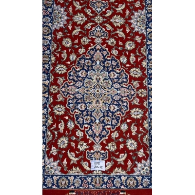 "Close-up of intricate floral pattern on red oriental rug runner from Isfahan"