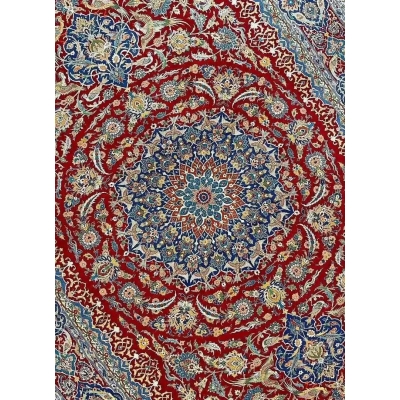 Detailed view of the Isfahan Persian carpet's central medallion in red and blue
