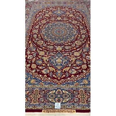 Close-up of the intricate blue and red patterns on the Isfahan Persian carpet