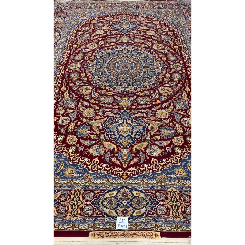 Close-up of the intricate blue and red patterns on the Isfahan Persian carpet