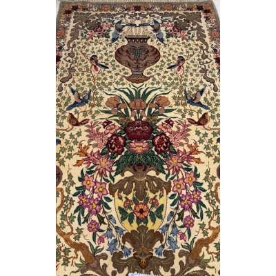 Close-up of the detailed floral craftsmanship on the luxury hand-knotted rug