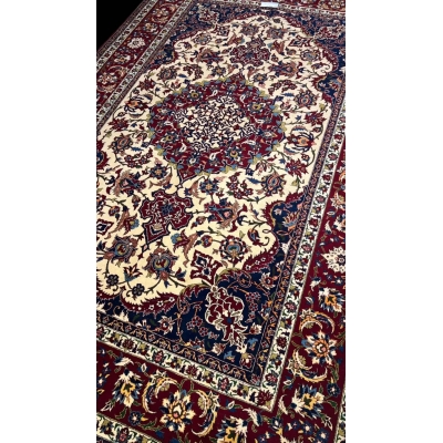 "Hand-knotted Persian rug in red and ivory with intricate floral design, crafted from wool and silk. Luxury oriental rug from Isfahan, Iran, featuring 1,000,000 knots per square meter for elegant, durable decor."

