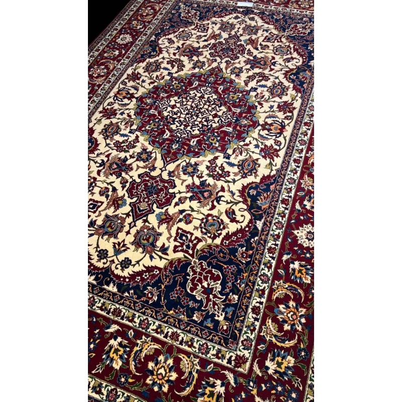 "Hand-knotted Persian rug in red and ivory with intricate floral design, crafted from wool and silk. Luxury oriental rug from Isfahan, Iran, featuring 1,000,000 knots per square meter for elegant, durable decor."