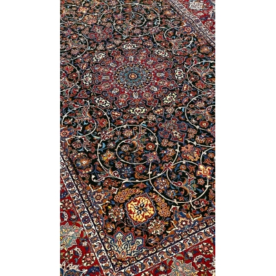 "Detailed corner view of the Seirafian carpet with traditional floral motifs."