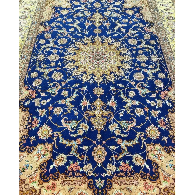 "Luxury Persian carpet featuring deep blue and gold hues, handwoven in Isfahan with silk and wool blend."