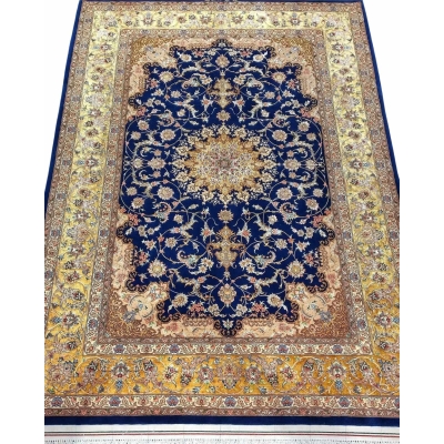 "Hand-knotted Isfahan Persian rug with a majestic navy blue background and golden floral medallion."