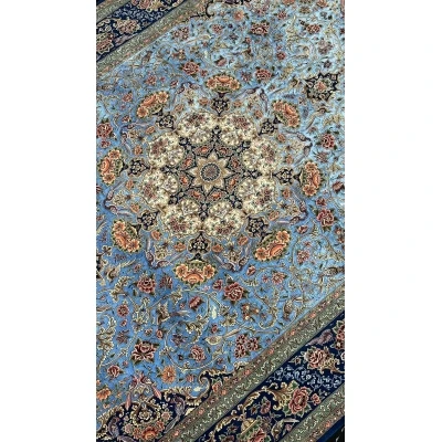 Luxurious blue Iranian carpet with detailed medallion and floral motifs