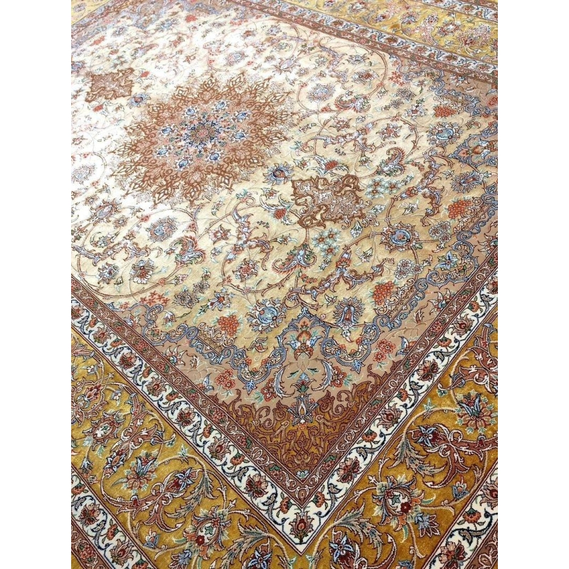 "Authentic Isfahan Persian rug with silk warp and a golden floral medallion, handwoven by Master Mohaghegh."