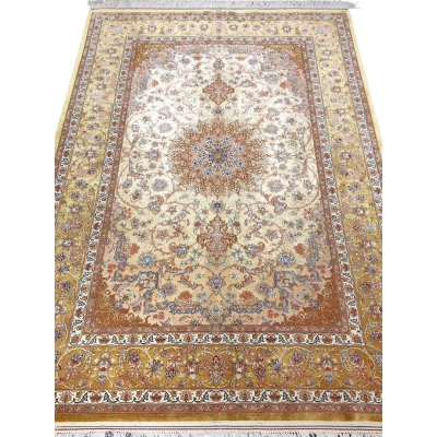 "Hand-knotted Isfahan Persian rug with a golden floral medallion design, crafted from fine wool and silk."
