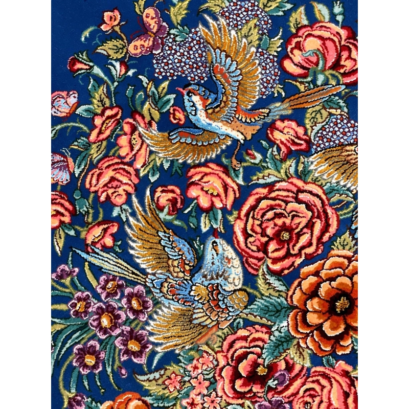 "Exquisite handmade Persian carpet with vibrant floral motifs, master craftsmanship, and a luminous silk finish."