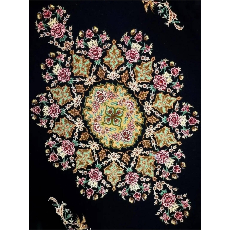 "Close-up of Persian rug featuring central medallion and floral designs."