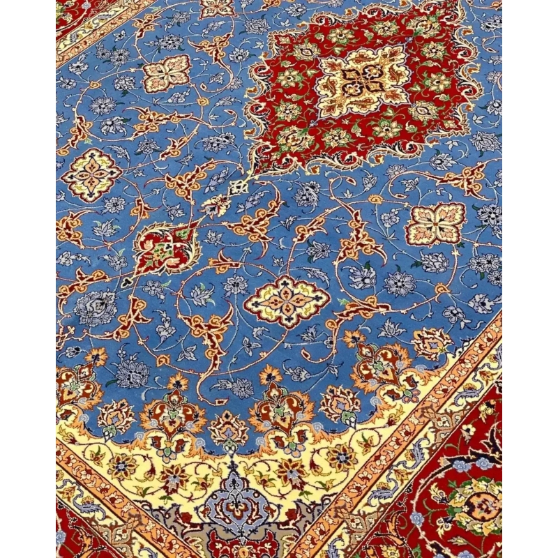 "Decorative wool and silk Persian rug, crafted by Saieed Davarie, with beautiful blue and red floral patterns, new and in stock."