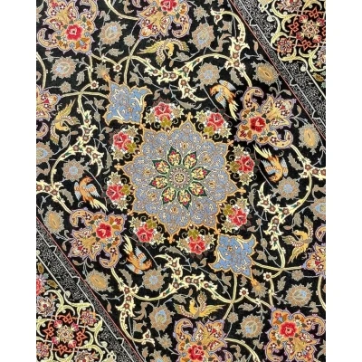 "Black and floral design Persian rug, crafted in Isfahan with silk and wool."