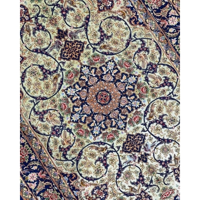 "Close-up view of handmade Isfahan rug, showcasing intricate floral and geometric designs in silk and wool."