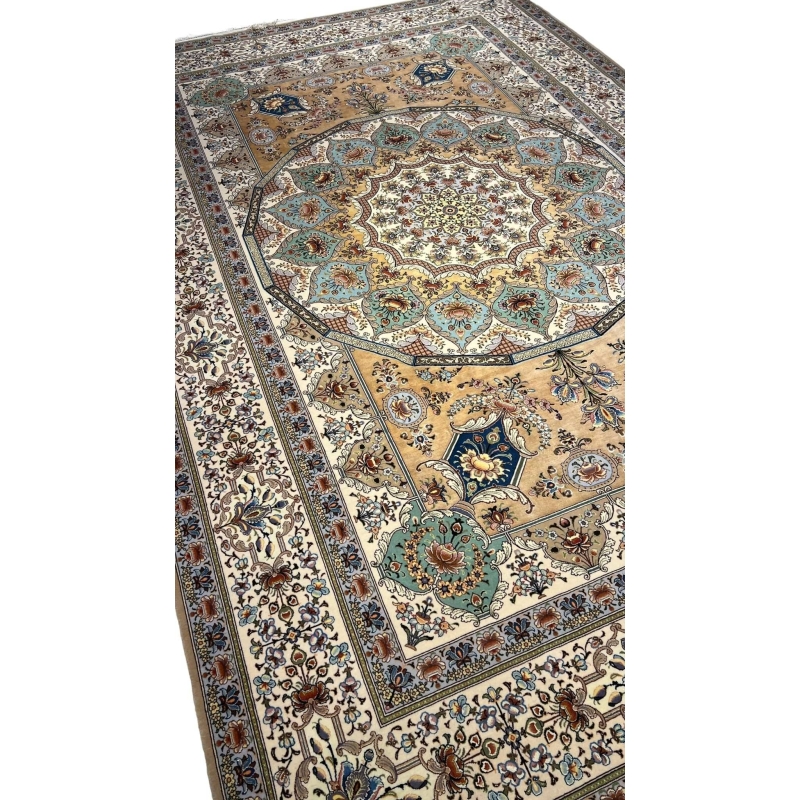 "Luxurious wool and silk Persian rug in ivory, gold, and teal tones, crafted in Isfahan, Iran."