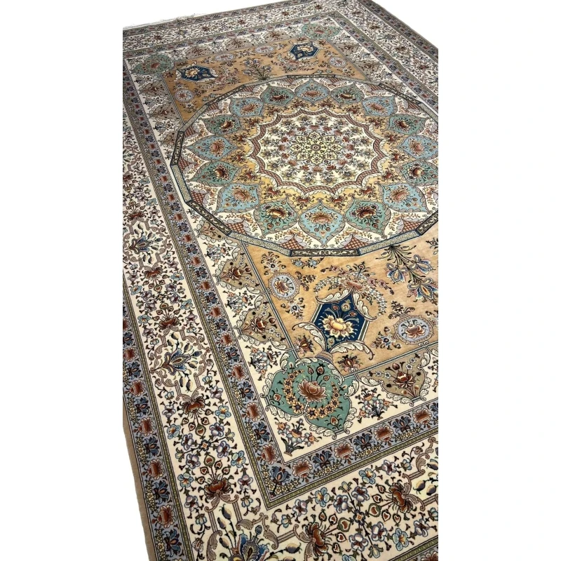 "Luxurious wool and silk Persian rug in ivory, gold, and teal tones, crafted in Isfahan, Iran."