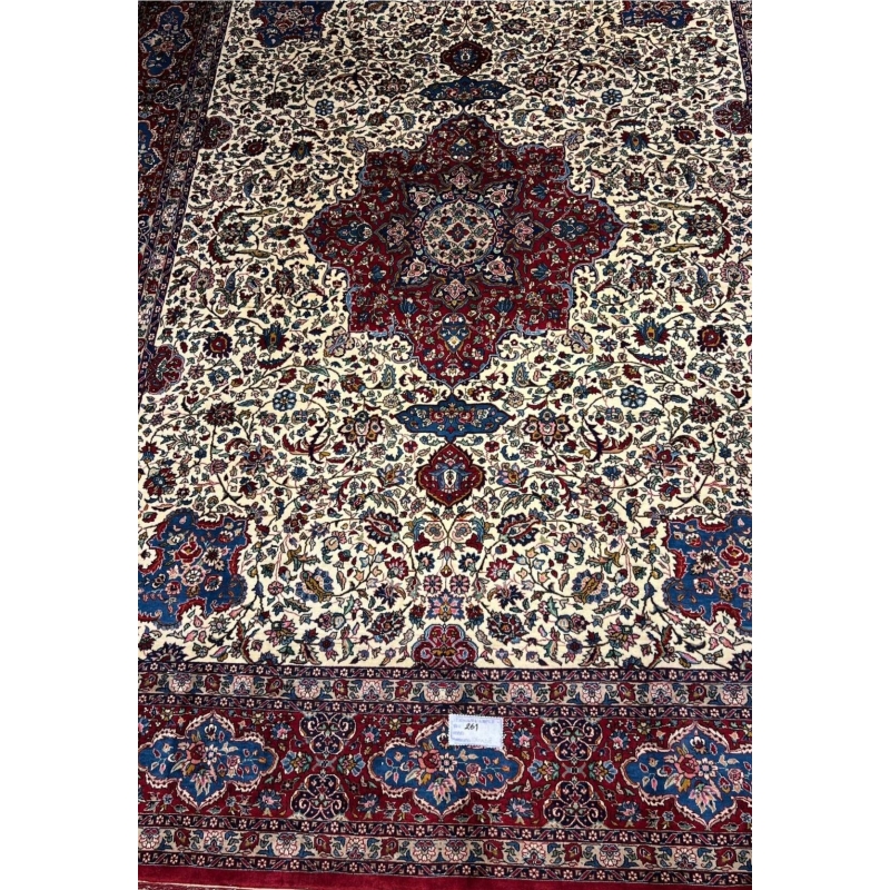 "70-year-old Isfahan rug, hand-knotted with traditional Persian craftsmanship"