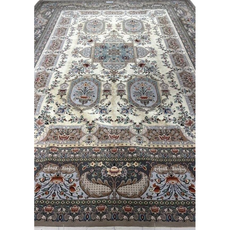 "Hand-knotted Persian Isfahan rug in golden-yellow tones with floral motifs, crafted by Master Moeidie."