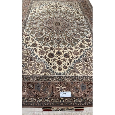 Vintage handwoven Persian carpet in beige and brown tones.