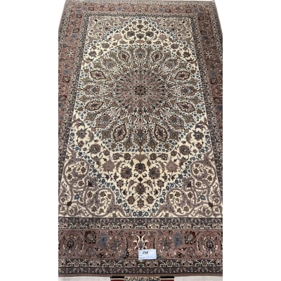 Persian Isfahan rug with central medallion and floral motifs.
