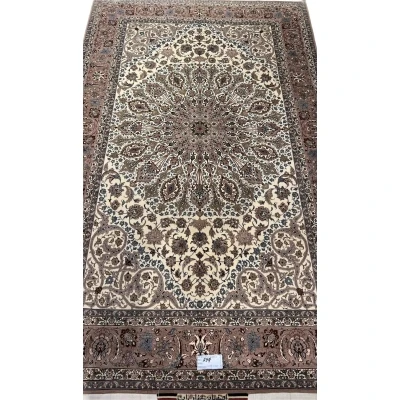 Persian Isfahan rug with central medallion and floral motifs.
