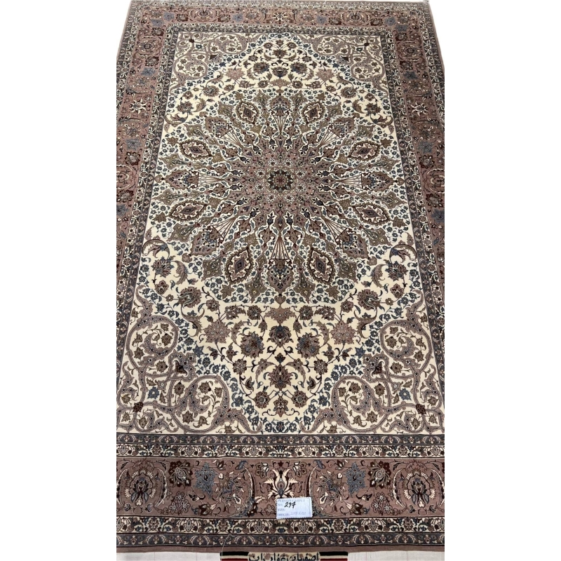 Persian Isfahan rug with central medallion and floral motifs.