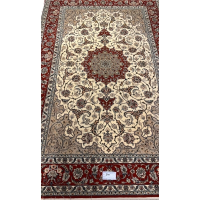 "Hand-knotted Persian Isfahan rug, crafted with silk and wool, featuring intricate traditional designs. Measuring 235 cm x 155 cm (7.7 ft x 5.1 ft) with a knot density of 810,000 knots per square meter. This luxurious handmade Persian rug adds timeless elegance to any space. Available for purchase online, with only one piece in stock."
