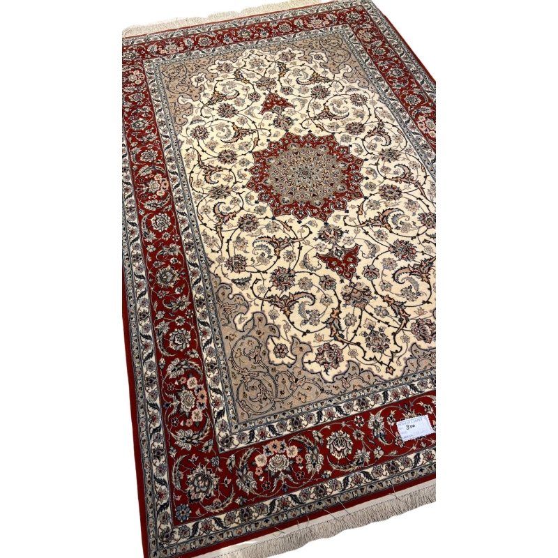 "Exquisite hand-knotted Persian rug from Isfahan, featuring luxurious silk and wool blend with a detailed red and ivory pattern. This 235 cm x 155 cm (7.7 ft x 5.1 ft) rug boasts 810,000 knots per square meter. Perfect for adding a touch of elegance to any room, this authentic Persian rug is available for online purchase with only one in stock."