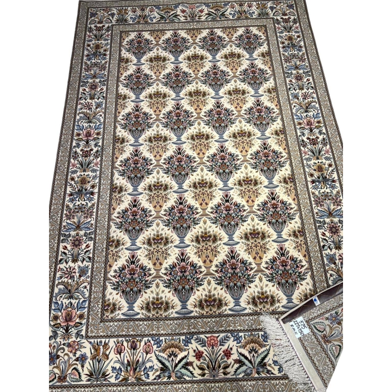 "Hand-knotted Persian rug in cream, blue, and pink tones from Isfahan"