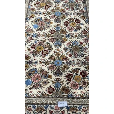 "Floral design on Isfahan Persian rug, hand-knotted with silk and wool."