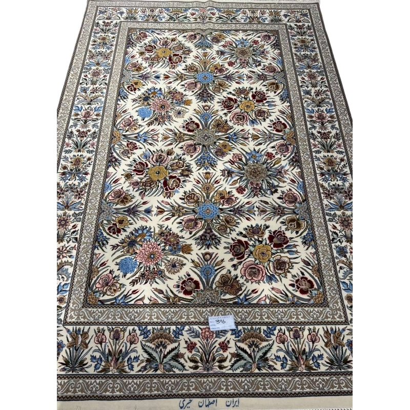 "Floral design on Isfahan Persian rug, hand-knotted with silk and wool."