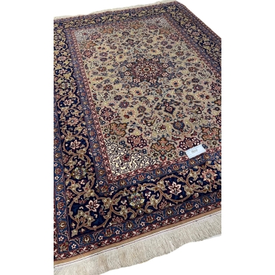 "Side view of the 70-year-old hand-knotted Isfahan rug with wool and silk blend."
