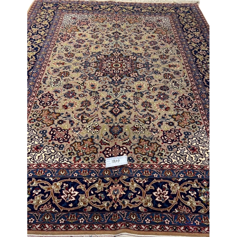 "Antique Isfahan rug, 70 years old, hand-knotted with floral patterns, 7 x 4.9 feet."