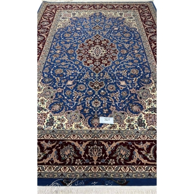 "Luxurious hand-knotted Persian carpet from Isfahan, Iran, with intricate floral motifs and silk highlights."