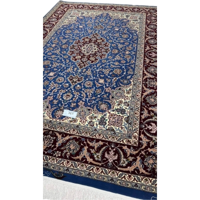 "Royal blue and burgundy Persian rug, crafted with wool and silk, showcasing a classic medallion pattern."