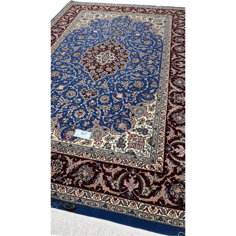 "Royal blue and burgundy Persian rug, crafted with wool and silk, showcasing a classic medallion pattern."