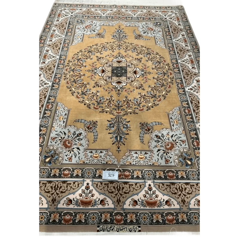 A detailed view of a luxurious Isfahan carpet with elaborate floral motifs and rich colors