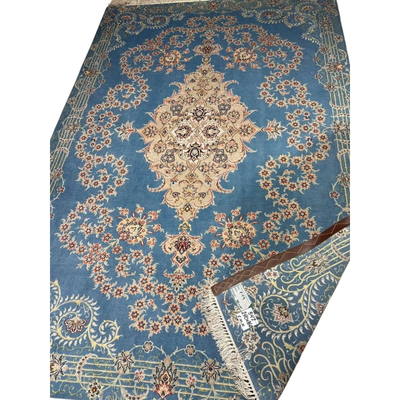 Elegant silk and wool Isfahan carpet with a central medallion design.