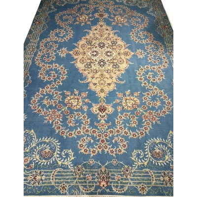 Sky blue Isfahan Persian rug with central cream medallion and floral motifs.
