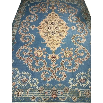 Sky blue Isfahan Persian rug with central cream medallion and floral motifs.
