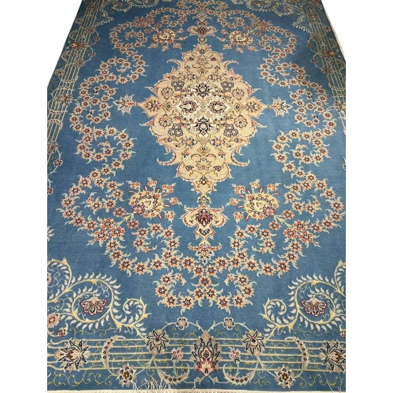 Sky blue Isfahan Persian rug with central cream medallion and floral motifs.