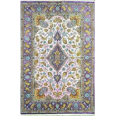 "Hand-knotted Isfahan silk Persian rug with pink and purple floral medallion design."