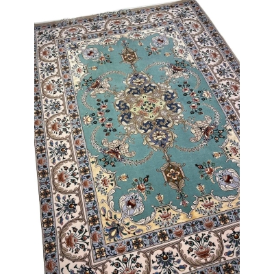 "Exquisite Persian rug measuring 172 x 119 cm with hand-knotted silk and wool detailing."