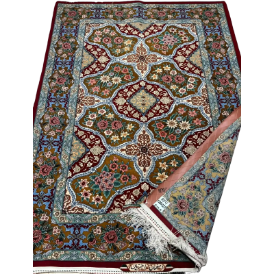 "Luxury Persian rug crafted from fine silk and wool, showcasing traditional Persian floral and geometric motifs."