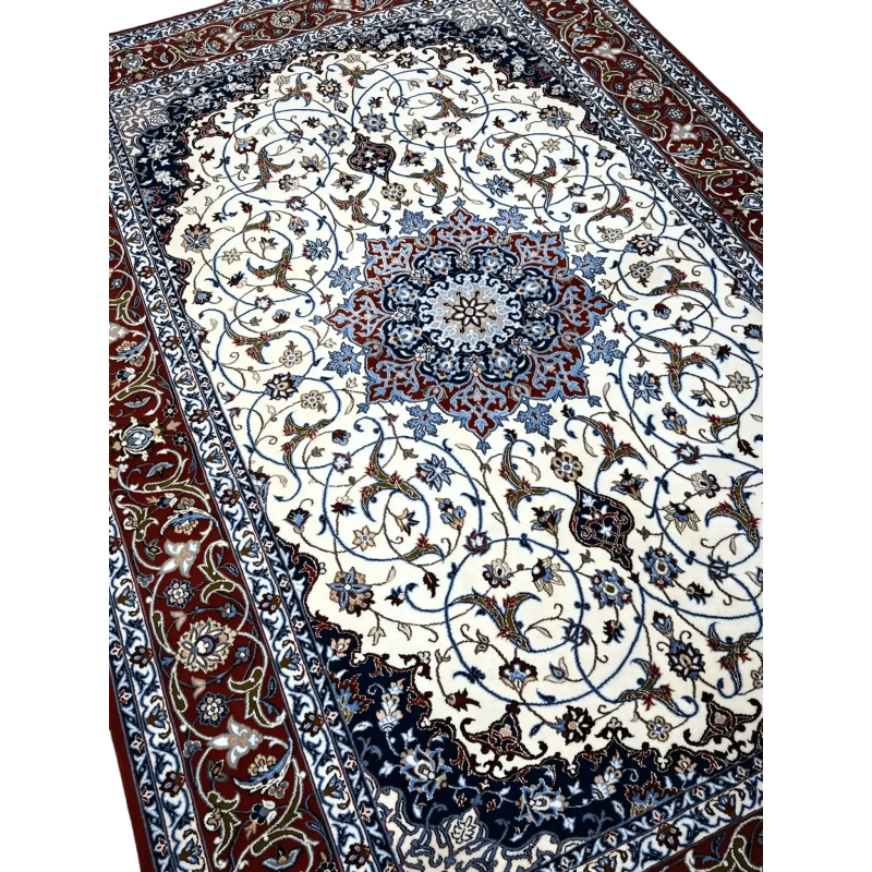 "Close-up of hand-knotted Isfahan carpet showcasing intricate floral motifs."