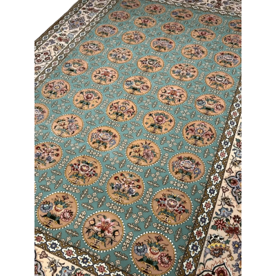 A detailed view of the floral motifs on an Isfahan rug with full framing