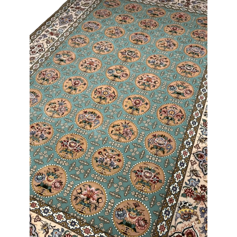 A detailed view of the floral motifs on an Isfahan rug with full framing