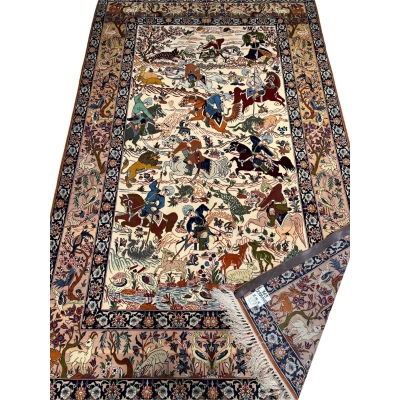 "Isfahan rug depicting a traditional hunting scene with wildlife motifs"