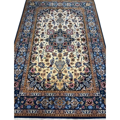 Hand-knotted Isfahan Persian rug with navy blue and golden tones.