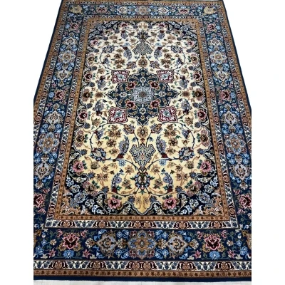 Hand-knotted Isfahan Persian rug with navy blue and golden tones.